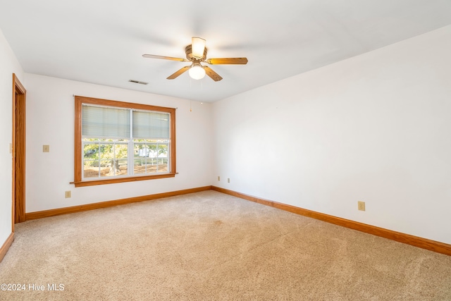 carpeted empty room with ceiling fan