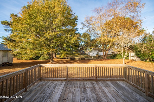 wooden terrace with a storage unit