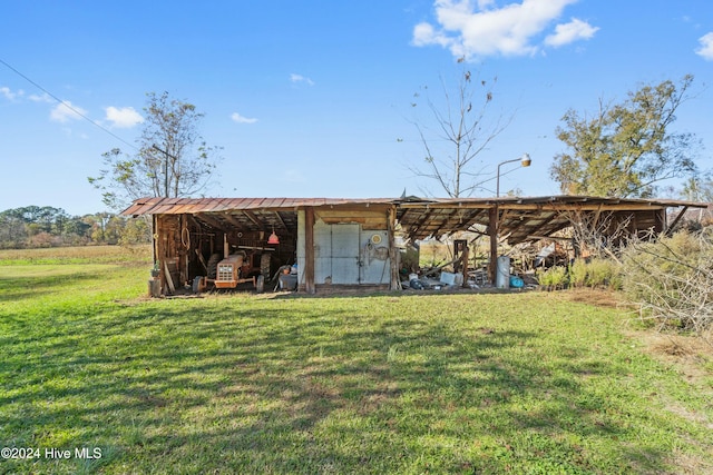 view of outbuilding with a yard