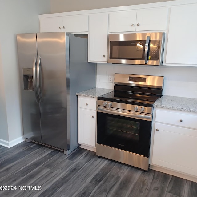 kitchen with decorative backsplash, light stone countertops, dark hardwood / wood-style flooring, stainless steel appliances, and white cabinetry