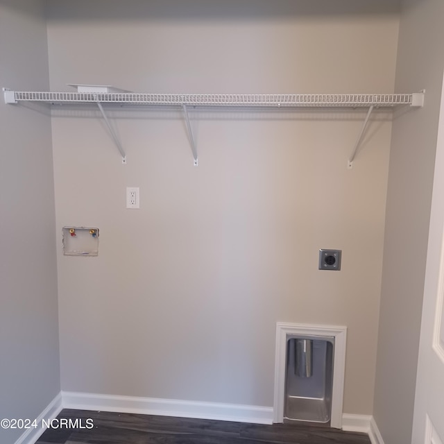 laundry area with electric dryer hookup, hookup for a washing machine, and dark wood-type flooring