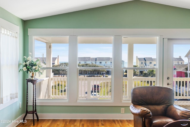 sunroom / solarium with vaulted ceiling