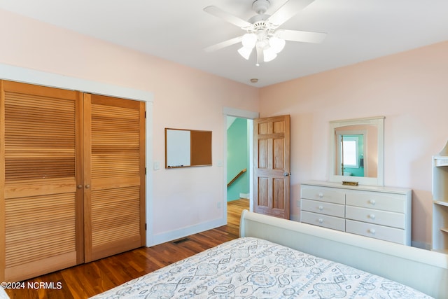 bedroom featuring ceiling fan, a closet, and hardwood / wood-style flooring