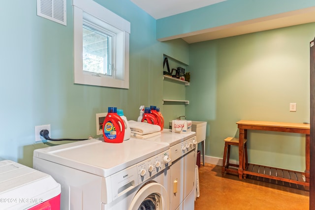 washroom featuring washing machine and dryer