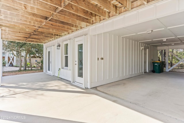 exterior space with a patio area and a carport