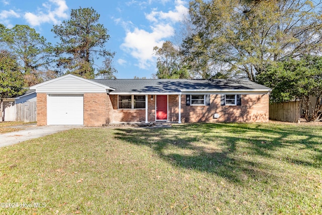 ranch-style house featuring a garage and a front lawn