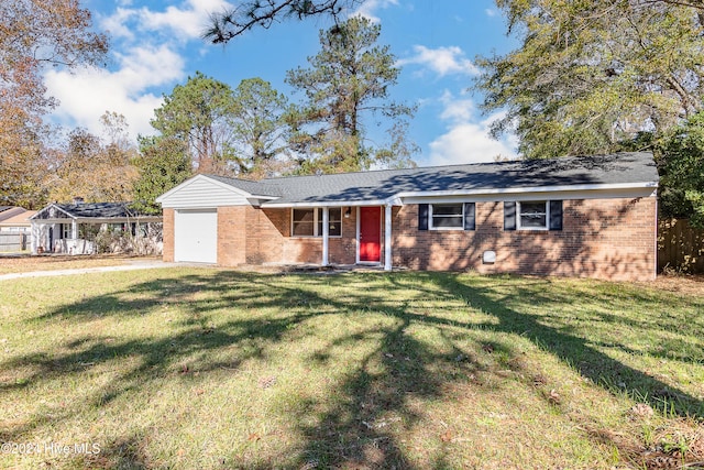 ranch-style home with a garage and a front lawn