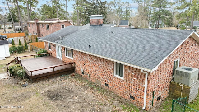 rear view of house with central air condition unit and a deck