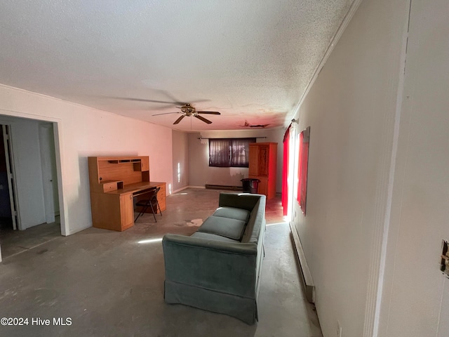 living room with ceiling fan, concrete flooring, and a textured ceiling