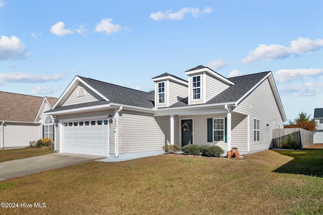 view of front of home featuring a garage and a front yard