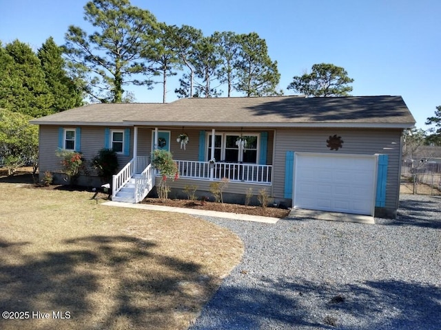 ranch-style home with a garage, driveway, and a porch