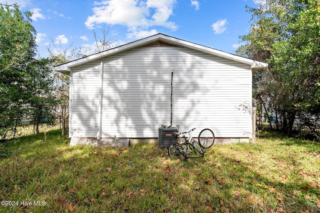 view of side of property with cooling unit