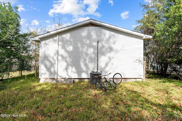 view of side of property with cooling unit