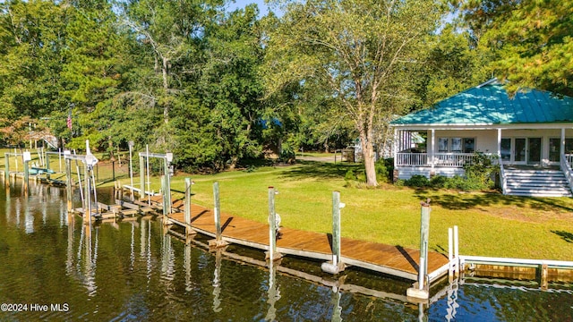 dock area featuring a water view and a yard