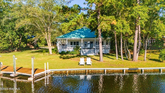 back of property featuring a water view