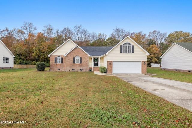 view of front of house featuring a garage and a front yard