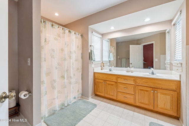 bathroom with tile patterned flooring, vanity, and a shower with shower curtain