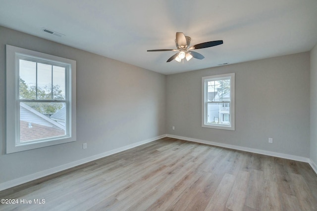 spare room featuring ceiling fan and light hardwood / wood-style floors