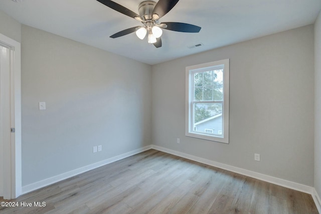 unfurnished room with ceiling fan and light hardwood / wood-style floors