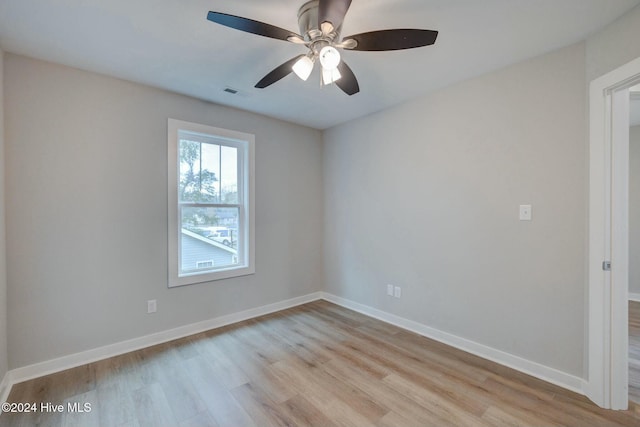 empty room with light hardwood / wood-style floors and ceiling fan