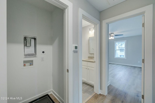 laundry room featuring electric dryer hookup, ceiling fan, hookup for a washing machine, and light wood-type flooring