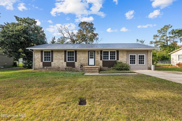 single story home with a front lawn and central air condition unit