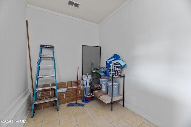 misc room featuring light tile patterned floors and ornamental molding