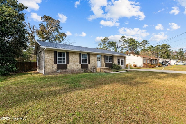 ranch-style house with a front lawn