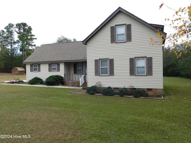 view of property featuring a front lawn