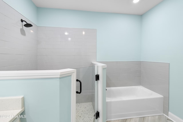 bathroom with vanity, independent shower and bath, and wood-type flooring