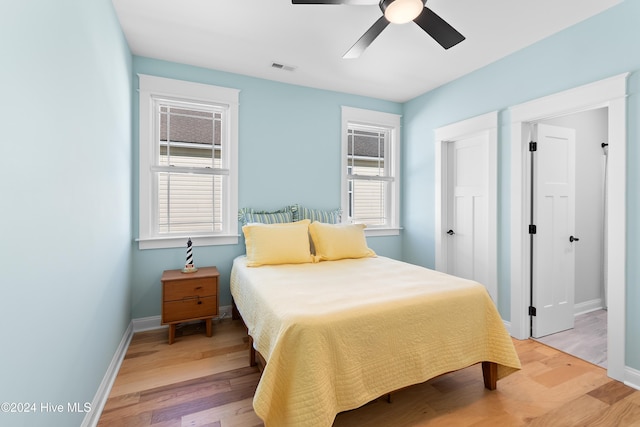 bedroom featuring light hardwood / wood-style flooring and ceiling fan