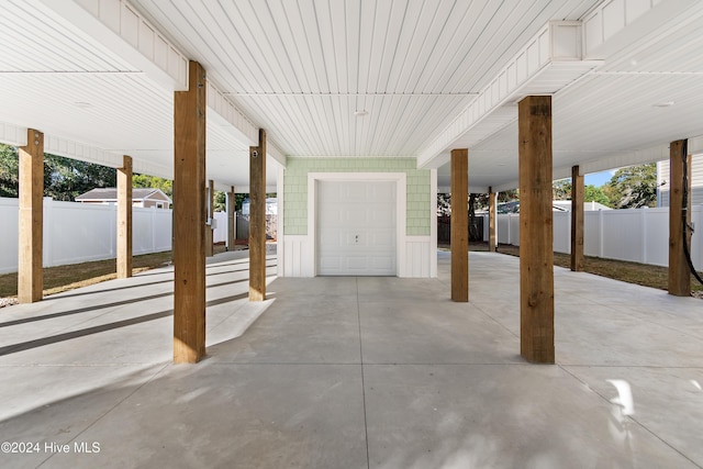 view of patio with a garage and a carport