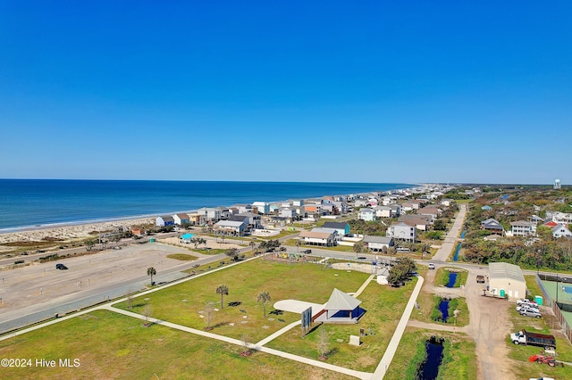 birds eye view of property with a view of the beach and a water view