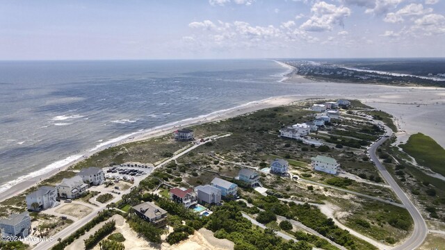 aerial view with a water view and a beach view