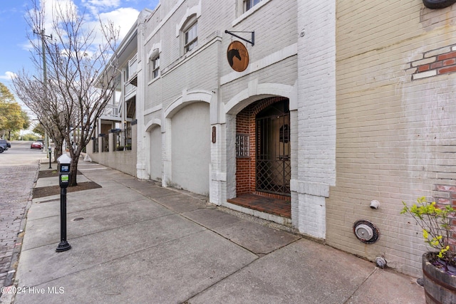 view of exterior entry featuring a garage