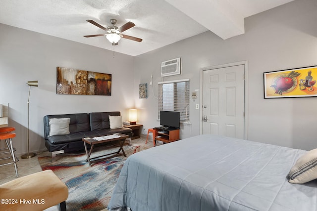 tiled bedroom featuring ceiling fan and a textured ceiling