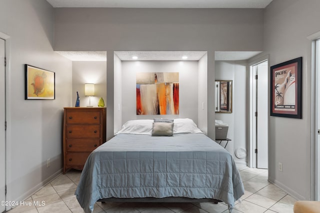 bedroom with light tile patterned flooring