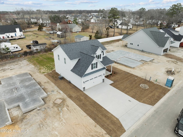 birds eye view of property with a residential view