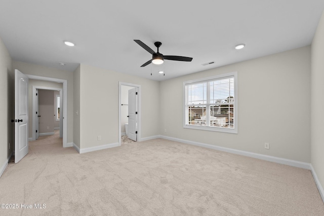 unfurnished bedroom featuring carpet floors, baseboards, visible vents, and recessed lighting