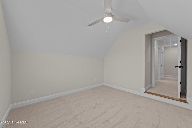 bonus room with attic access, baseboards, lofted ceiling, ceiling fan, and carpet flooring