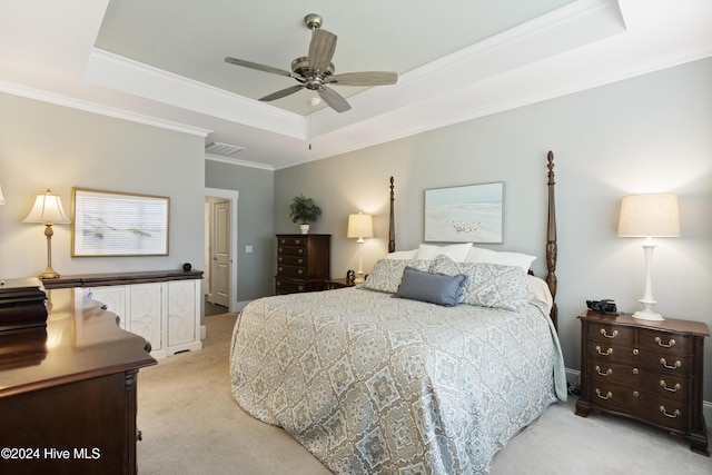 bedroom with light colored carpet, a raised ceiling, ceiling fan, and crown molding