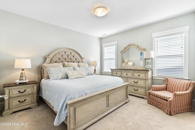 bedroom with light colored carpet