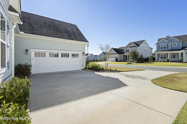 view of property exterior with a garage