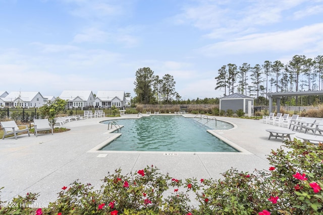 view of swimming pool with a patio area