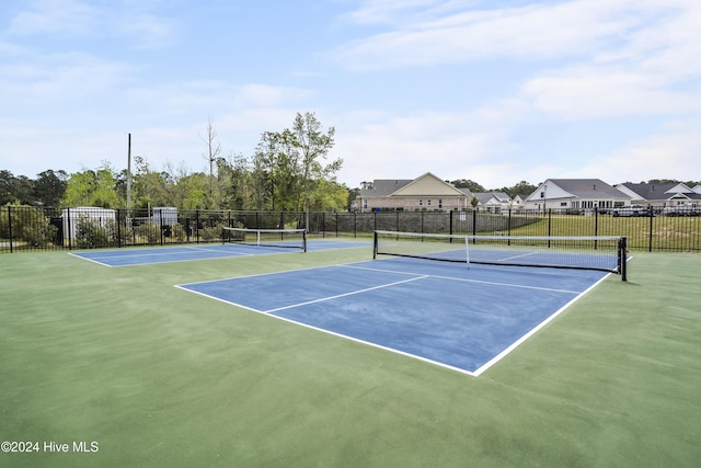 view of sport court featuring basketball hoop