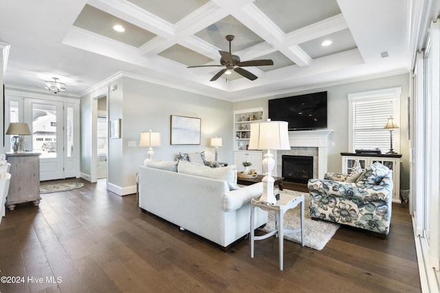 living room featuring a wealth of natural light, a fireplace, and ornamental molding