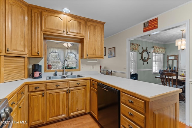 kitchen with sink, dishwasher, stove, a notable chandelier, and kitchen peninsula