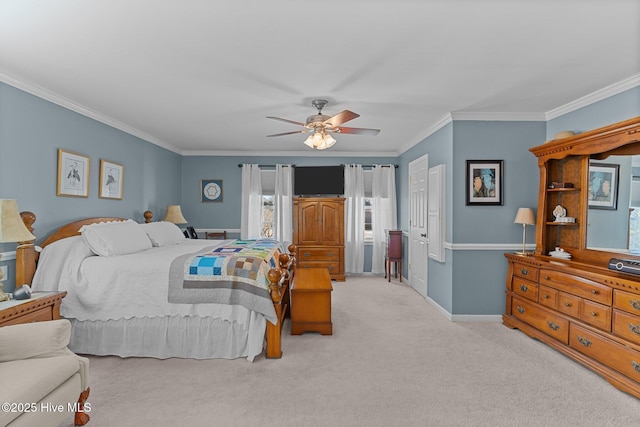 carpeted bedroom featuring ceiling fan and ornamental molding