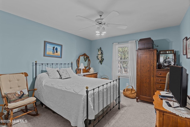 bedroom featuring ceiling fan and light colored carpet