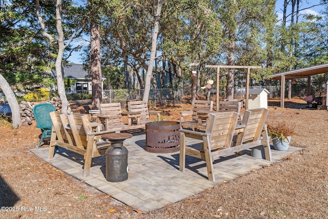 view of patio with a fire pit